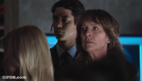 Woman In Pearl Necklace In Dark Room GIF