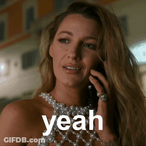 Woman In Pearl Necklace Talking On Cell Phone Saying Yeah GIF