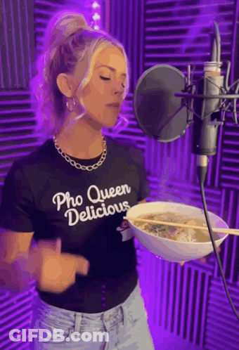Woman In Pho Queen Delicious Shirt Holding Soup At Microphone GIF