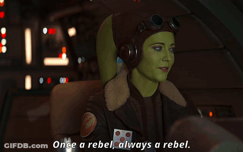 Woman In Pilot Helmet Saying Once A Rebel Always A Rebel GIF