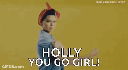 Woman In Pin Up Outfit Flexing Muscles GIF