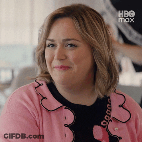 Woman In Pink And Black Sweater With Heart And HBO Max Logo GIF