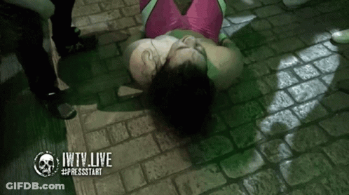 Woman In Pink And Green Outfit Laying On Ground Jwtv Live GIF