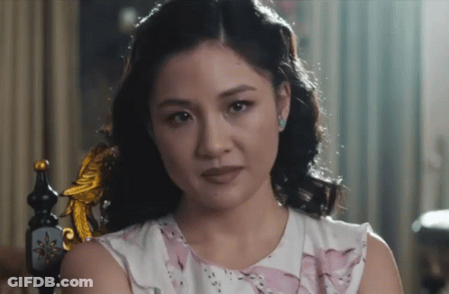 Woman In Pink And White Dress Sitting GIF