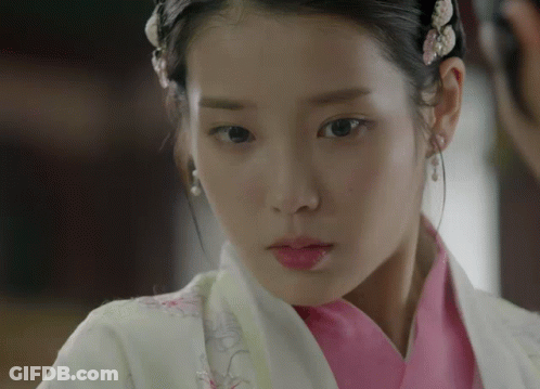 Woman In Pink And White Outfit Close Up GIF