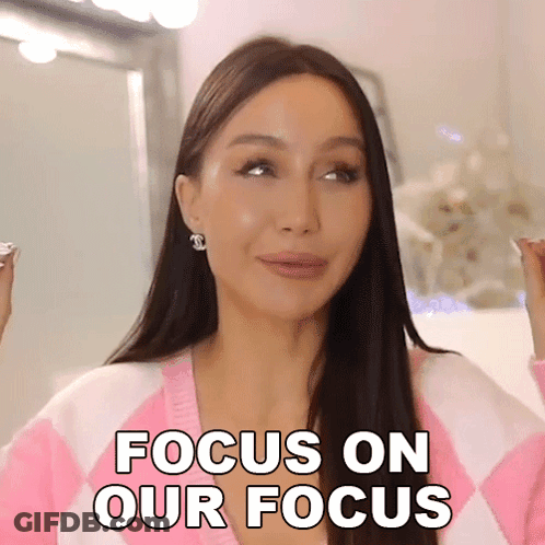 Woman In Pink And White Sweater Saying Focus On Our Focus GIF