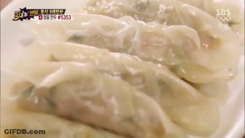 Woman In Pink Apron Preparing Food In Kitchen GIF