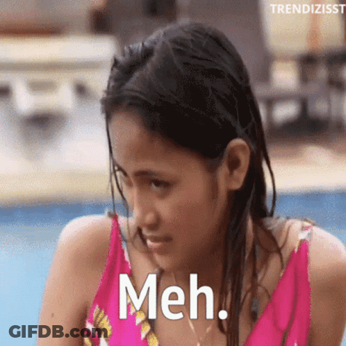 Woman In Pink Bathing Suit Saying Meh GIF