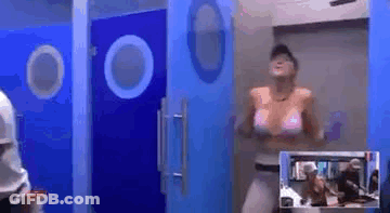 Woman In Pink Bikini Dancing In Bathroom With Blue Doors GIF