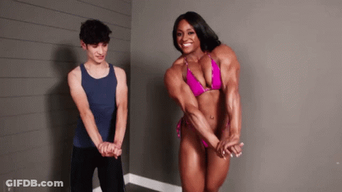 Woman In Pink Bikini Next To Man In Tank Top GIF