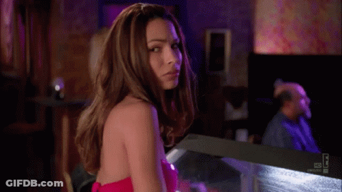 Woman In Pink Bikini Standing Next To Man GIF