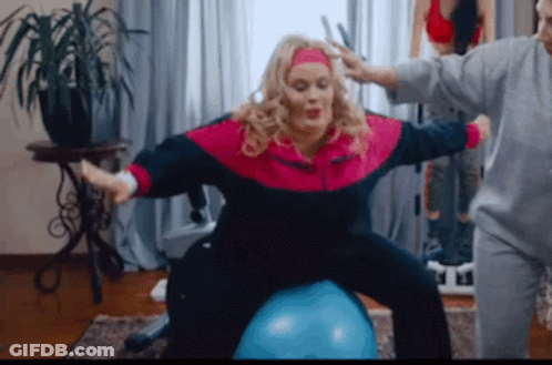 Woman In Pink Blue Jacket On Blue Ball GIF