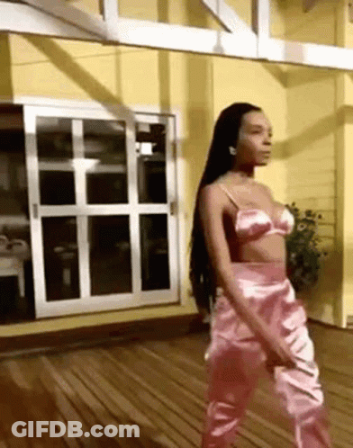 Woman In Pink Bra And Pants On Wooden Deck GIF