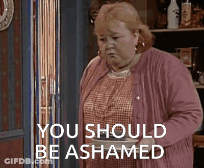 Woman In Pink Cardigan Saying You Should Be Shamed GIF