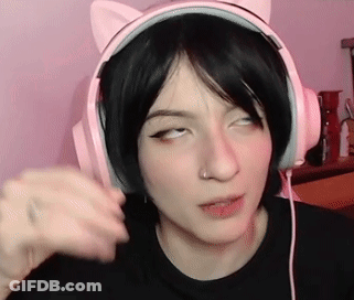Woman In Pink Cat Ear Headphones Making A Face GIF