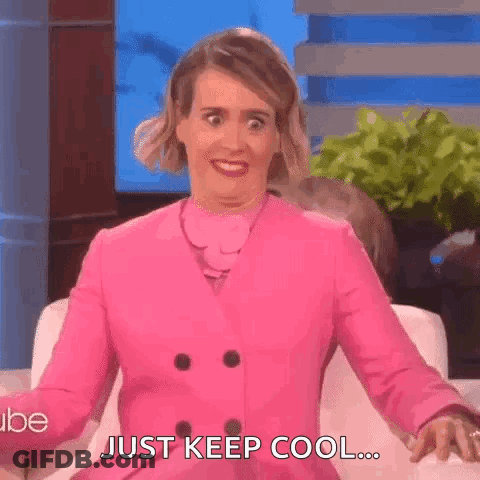 Woman In Pink Coat Making Funny Face GIF