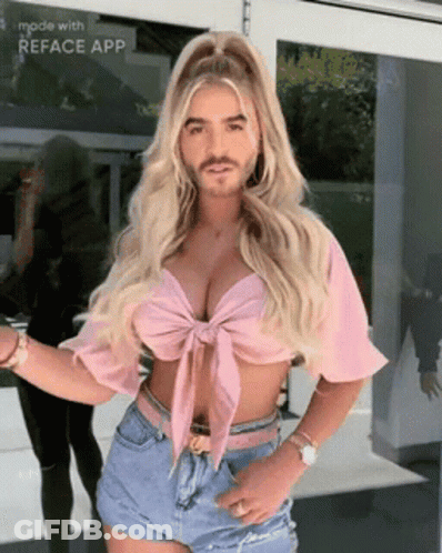 Woman In Pink Crop Top And Denim Shorts With Man Face On Her Face GIF