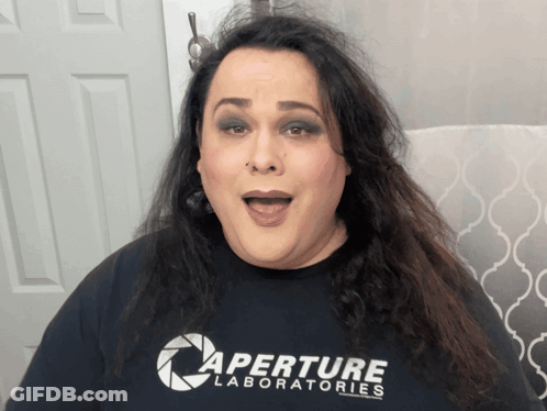 Woman In Pink Crop Top With Man's Face On Her Face GIF