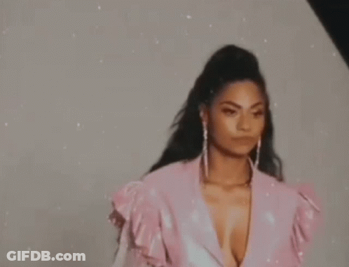 Woman In Pink Dress And Earrings GIF