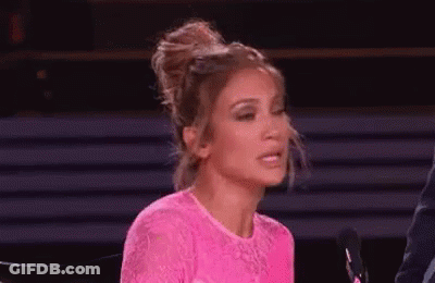 Woman In Pink Dress At Microphone GIF