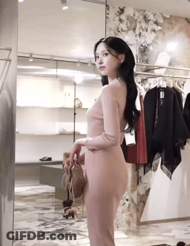 Woman In Pink Dress At Store Mirror GIF