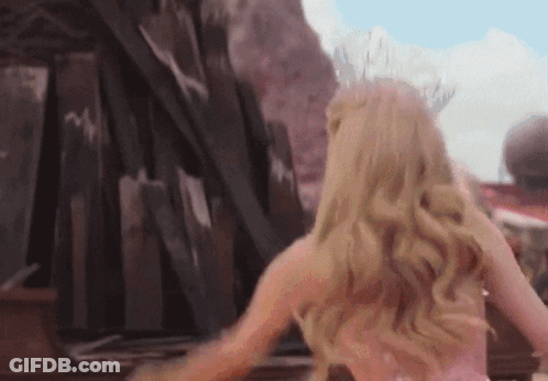 Woman In Pink Dress By Wooden Fence GIF
