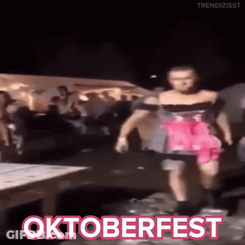 Woman In Pink Dress Dancing At Oktoberfest GIF