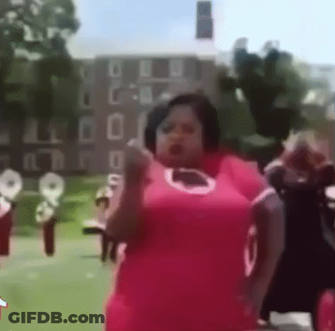 Woman In Pink Dress Dancing Front Of Band GIF