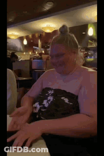 Woman In Pink Dress Dancing In Front Of Crowd GIF