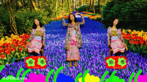 Woman In Pink Dress Dancing With Boombox In Flowers GIF