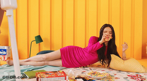 Woman In Pink Dress Eating Cereal GIF