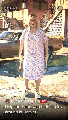 Woman In Pink Dress Holding Hammers In Front Of Brown Car GIF