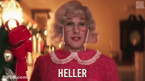 Woman In Pink Dress Holding Red Bow With Heller Behind GIF