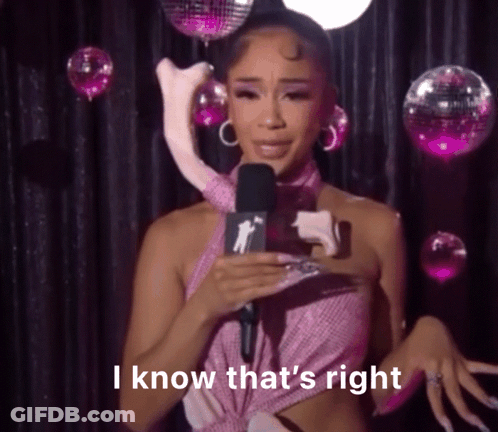 Woman In Pink Dress Holding Stuffed Animal GIF
