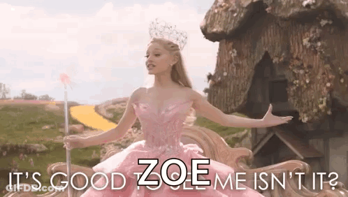 Woman In Pink Dress Holding Wand Says It's Good Zoe Me Isn't It GIF