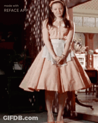 Woman In Pink Dress In Front Of Mirror Made With Reface App GIF