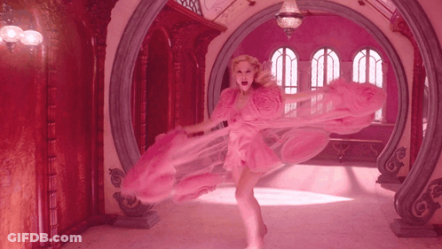 Woman In Pink Dress In Pink Room GIF