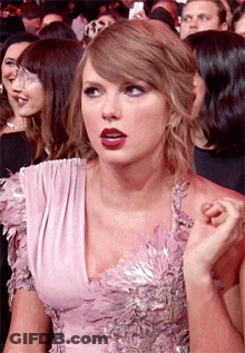 Woman In Pink Dress Looking GIF