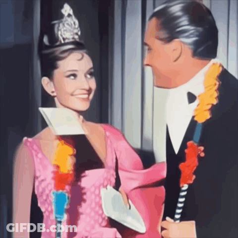 Woman In Pink Dress Man In Tuxedo Smiling GIF