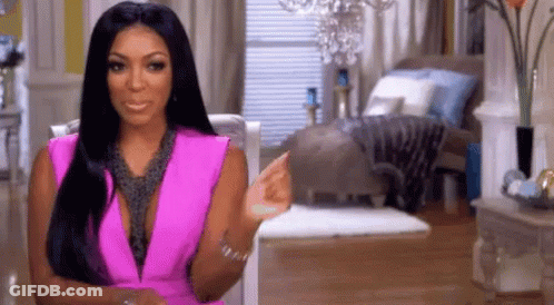 Woman In Pink Dress Pointing GIF