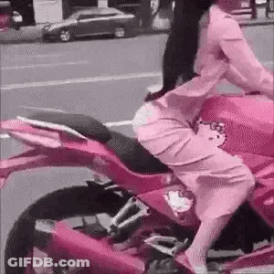 Woman In Pink Dress Riding Pink Motorcycle GIF