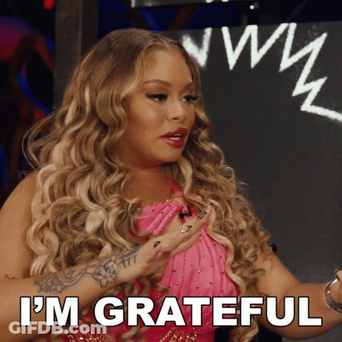 Woman In Pink Dress Saying Im Grateful GIF