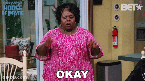 Woman In Pink Dress Says Okay GIF