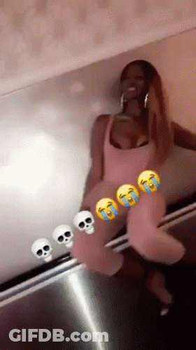 Woman In Pink Dress Sitting In Front Of Skull Wall GIF
