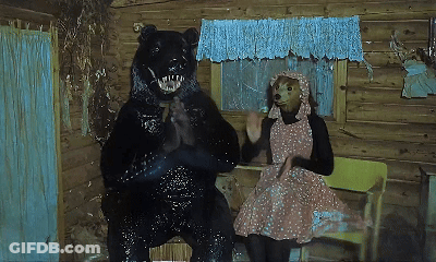 Woman In Pink Dress Sitting Next To Bear GIF