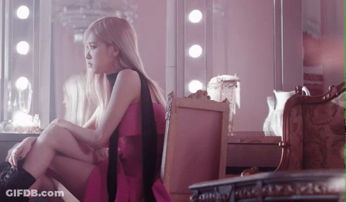 Woman In Pink Dress Sitting On Chair GIF