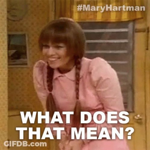 Woman In Pink Dress Smiling What Does That Mean GIF