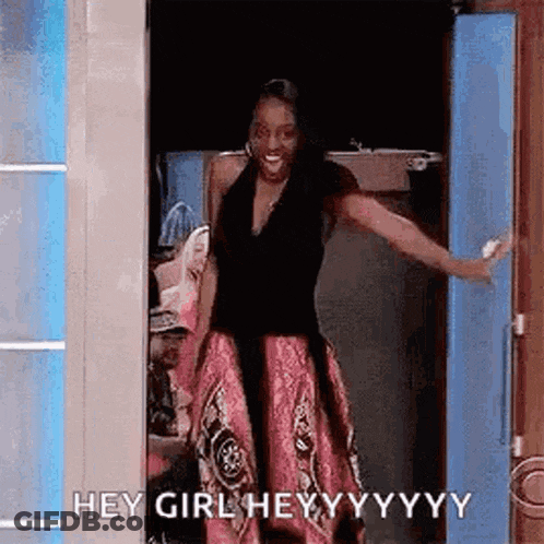 Woman In Pink Dress Standing In Doorway GIF