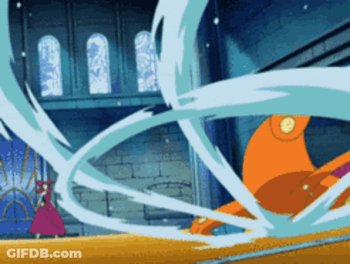 Woman In Pink Dress Standing In Front Of Large Orange Object GIF
