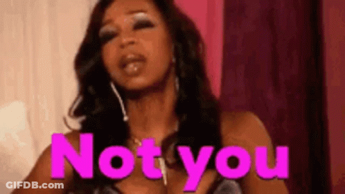 Woman In Pink Dress Standing In Front Of Not You Sign GIF
